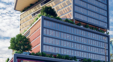 The Western Sydney University Bankstown campus is shown -a striking tall, stacked-block building with a modern, contemporary architectural style.